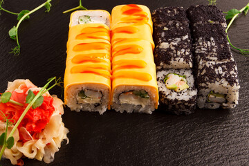 Japanese food: Set of salmon sushi and rolls with salmon and eel