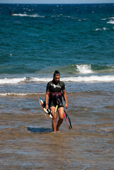 Athens, Greece, July 2020: Windsurfing and Kite Surfing on a very sunny day 