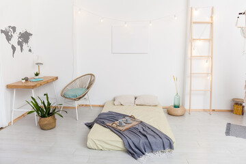 living room with hammock and white walls