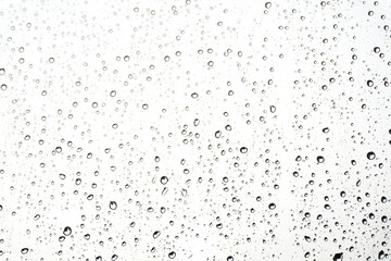 Water drops on glass. Rain droplets on window surface - obrazy, fototapety, plakaty
