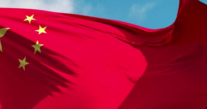 China and USA flag on a flagpole waving in the wind in the sky. Wonderful intro for yor projects. China and The United States of America. 