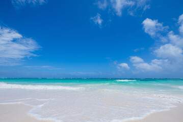 Caribbean sea at noon, white sands.