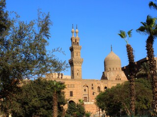 Fototapeta na wymiar Far away view of the dome and minaret of bin ramah mosque in Cairo