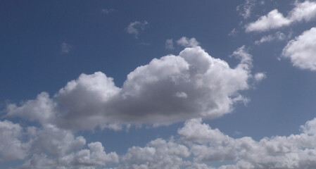 fluffy blue sky with clouds with main cloud 
