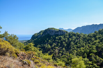 View from the top on rocks, beaches and sea. Beautiful nature landscapes in Turkey mountains. Lycian way is famous among hikers.