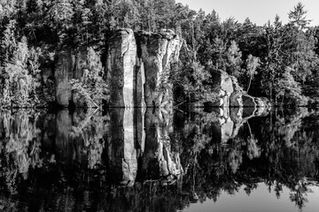 Fototapeta na wymiar Sandstone rock towers reflected in Vezak Pond, Czech: Vezicky rybnik, Bohemian Paradise, Czech: Cesky Raj, Czech Republic
