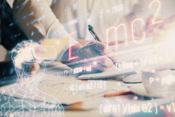 Double exposure of formula drawing over people taking notes background. Concept of education