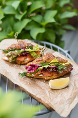 Smoked Salmon and Cream Cheese Croissant. Breakfast in Summer Garden