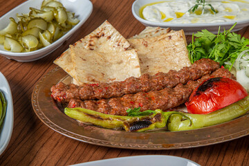 Turkish Adana Kebab Dinner on wooden background.