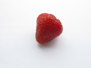 Juicy, appetizing, red strawberry on a white background.