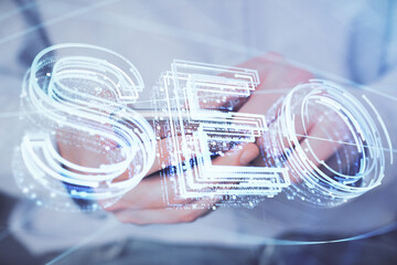 Multi exposure of man's hands holding and using a digital device and seo drawing. search optimization concept.