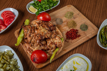 Turkish chicken butterfly on a wooden background.