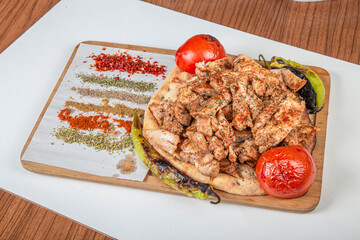 Turkish chicken meal on a wooden background.