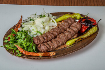 Turkish Urfa Kebab Skewer Dinner on Wooden Background