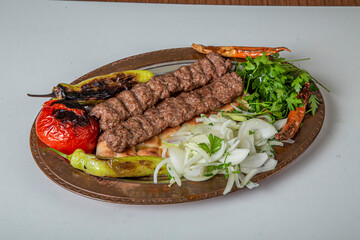 Turkish Urfa Kebab Skewer Dinner on Wooden Background