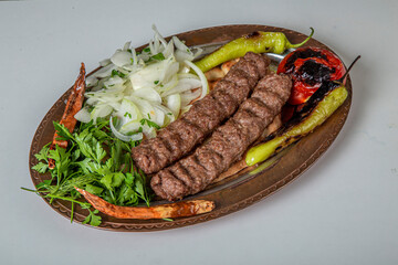 Turkish Urfa Kebab Skewer Dinner on Wooden Background
