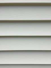 Recently cleaned vinyl siding on a white house