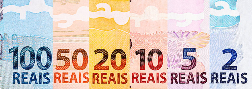 banknotes of money of brazil, in composite. Details of notes of 100, 50, 20, 10, 5 and 2 reais. Brazil economy concept