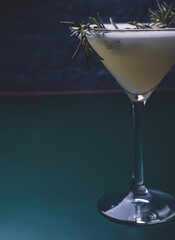 Rosemary martini in dark mood lighting