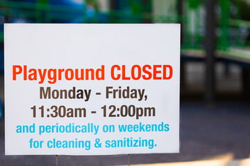 Sign on playground saying it will be closed for sanitizing because of Covid 19
