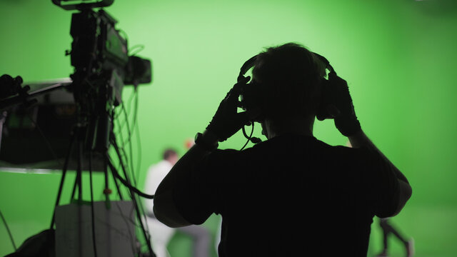 Film Crew In Green Studio