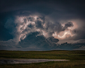 Fototapeta na wymiar Lightning, Thunder and Severe Weather Over Bodies of Water on the Greta Plains