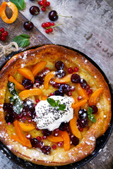 Selective focus. Macro. Dutch baby pancake with fruit. Healthy breakfast or dessert.