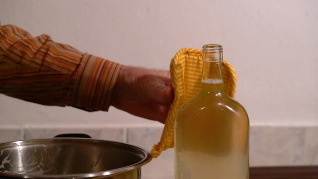 Closing bottles with Elder Flower Juice and transferring to storage (Sambucus nigra) - (4K)