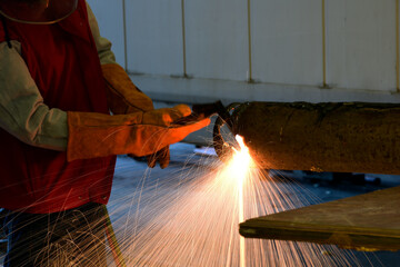 Industrial Worker at the factory Gas cutter cutting on steel close-up