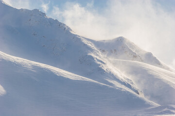 Fototapeta na wymiar Windblown Snow Covered Peak,Chugach Mountains,Portage,Alaska,USA