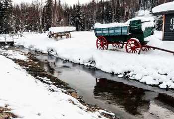 Snow Covered Wagons Beside Creek,Chena Hot Springs,Alaska,USA