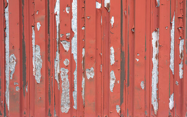 Rusty metal or iron texture background with flaking red paint