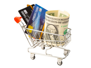 Credit card and US dollar banknotes in shopping cart isolated on white background, finance concept.