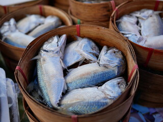 steamed mackerel in the basket for sale on market.