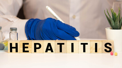 Hepatitis word written on wood block