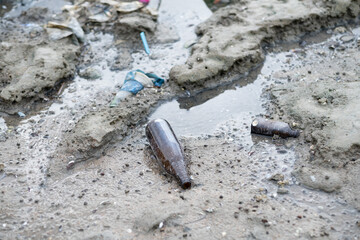 garbage on the beach, dirty sea
