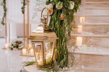 Beautiful luxury wedding reception with flowers. Stairs decorated with flowers