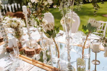 Romantically decorated table for a special event. Beautiful floral decoration for the celebration