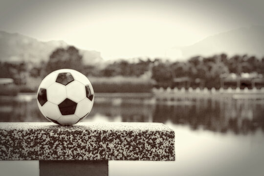 Soccer ball by the lake