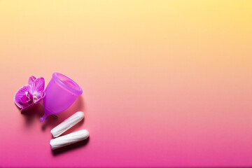 Feminine hygiene products on bright pink background