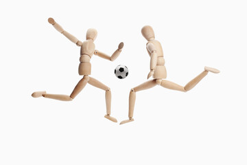 Wooden dummies models playing soccer