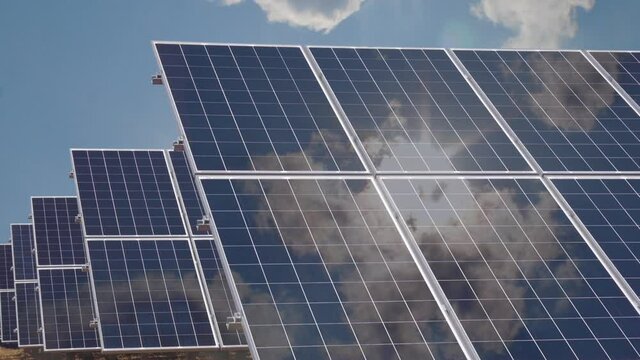Solar panels with Sunlight reflection, time lapse