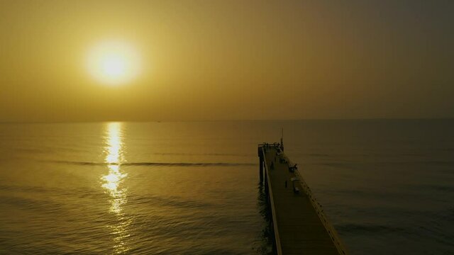Saharan dust sunrise at the Saint Augustine Beach pier on Florida's east coast.