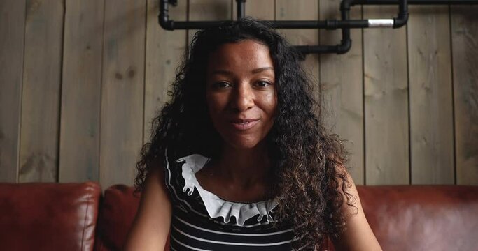 Happy smiling african american woman making conference call for distance online job interview communicating with hr employer answering recruiting questions in videoconference chat, webcam view