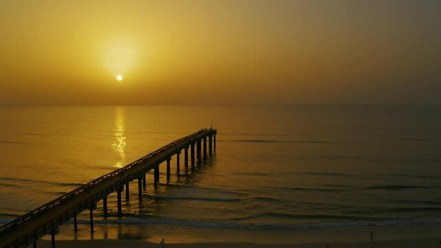 Saharan dust sunrise at the Saint Augustine Beach pier on Florida's east coast.