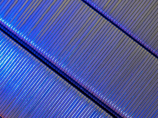 Obraz premium Cobalt blue and purple illuminated diagonally placed metal staples