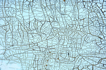 blue and turquoise old Board with cracks from old paint, vintage grunge style with cracked surface background for your text, decoration or advertising template, retro art