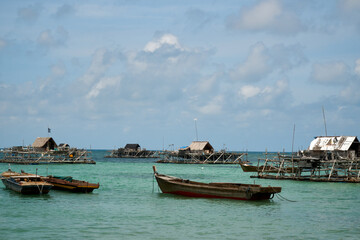 Boats and wooden fisherman house at the sea