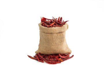 Dried red hot chili peppers in a sack of food ingredients Isolated on white background.