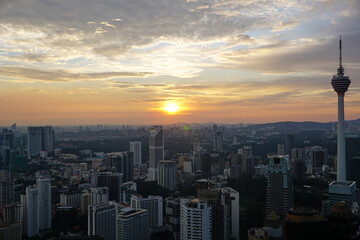 Fototapeta premium Skyline of KL tower and skyscrapers during sunset 